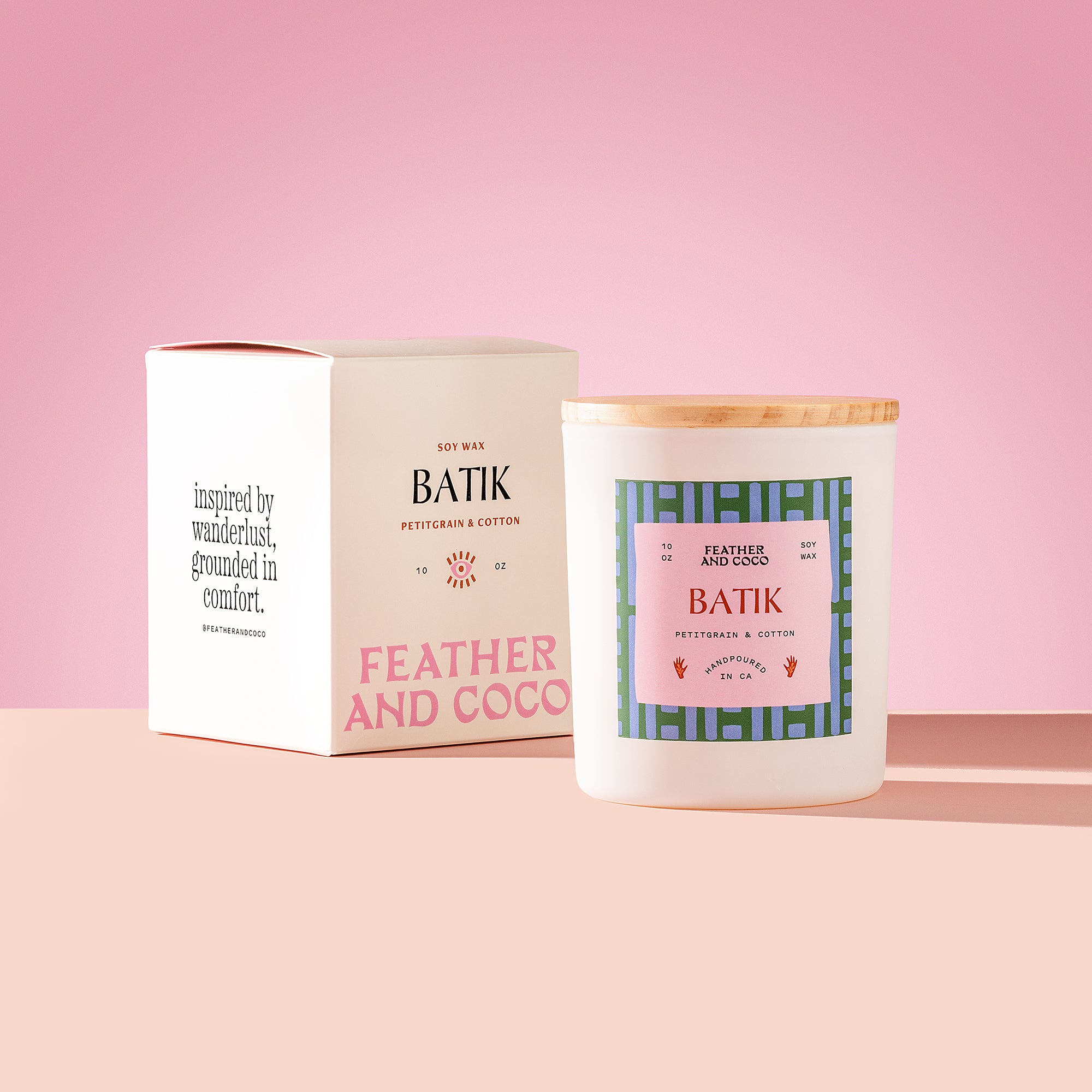 Batik Candle with wooden lid on a pink background