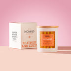 Nomad Candle with wooden lid on a pink background