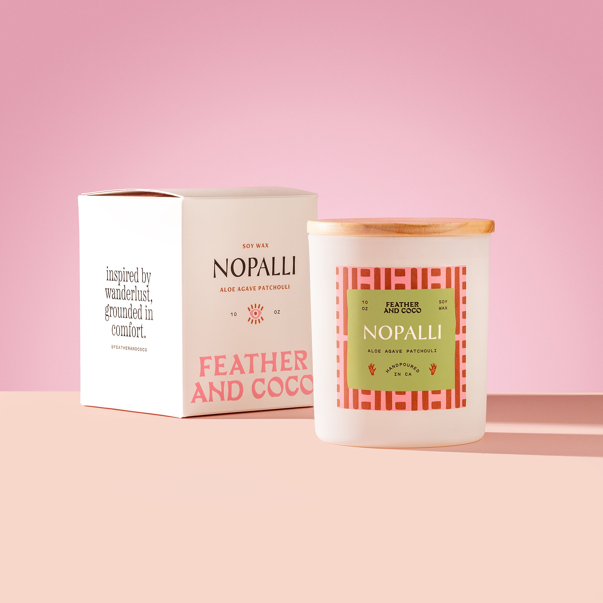 Nopalli Candle with wooden lid on a pink background