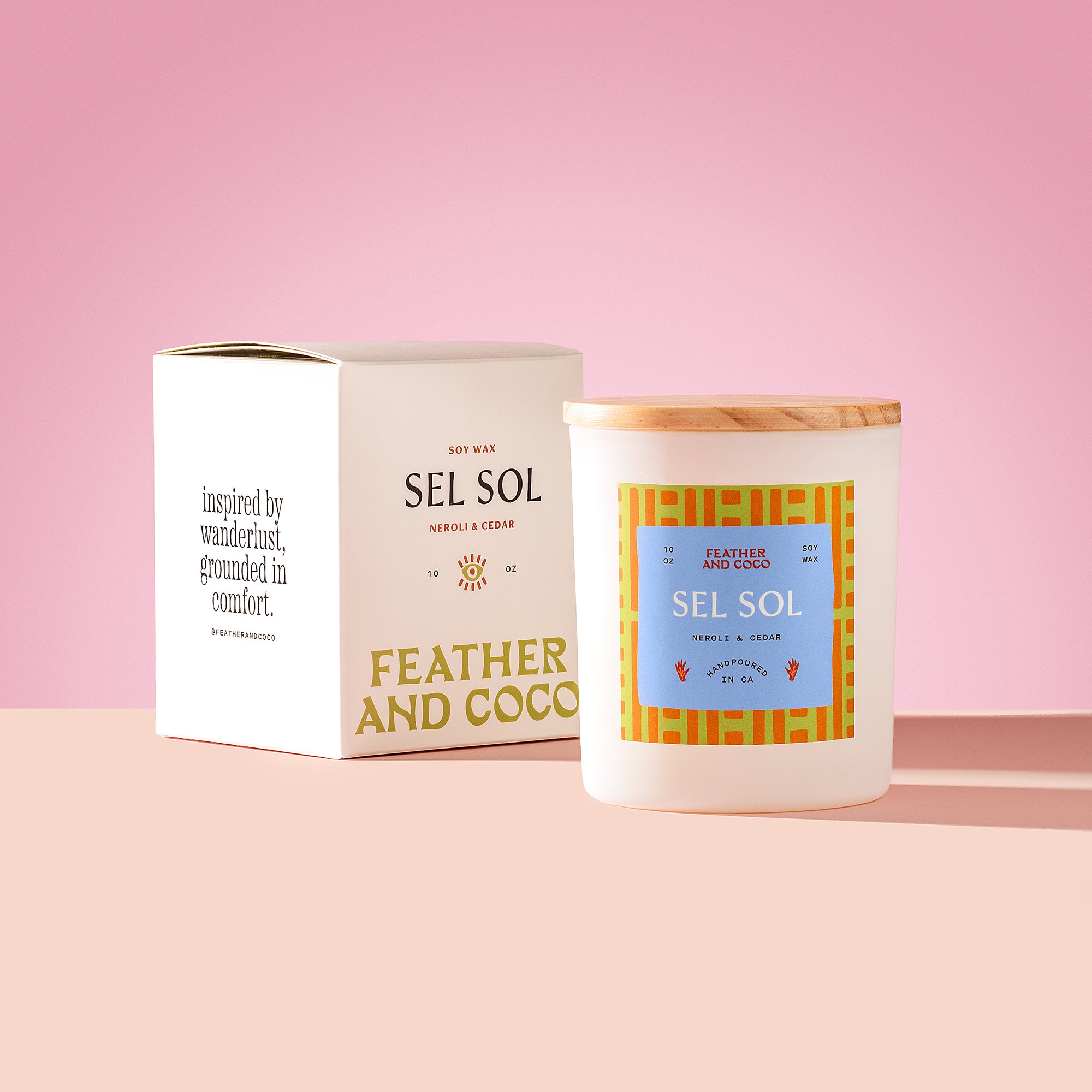 Sel Sol Candle with wooden lid on a pink background