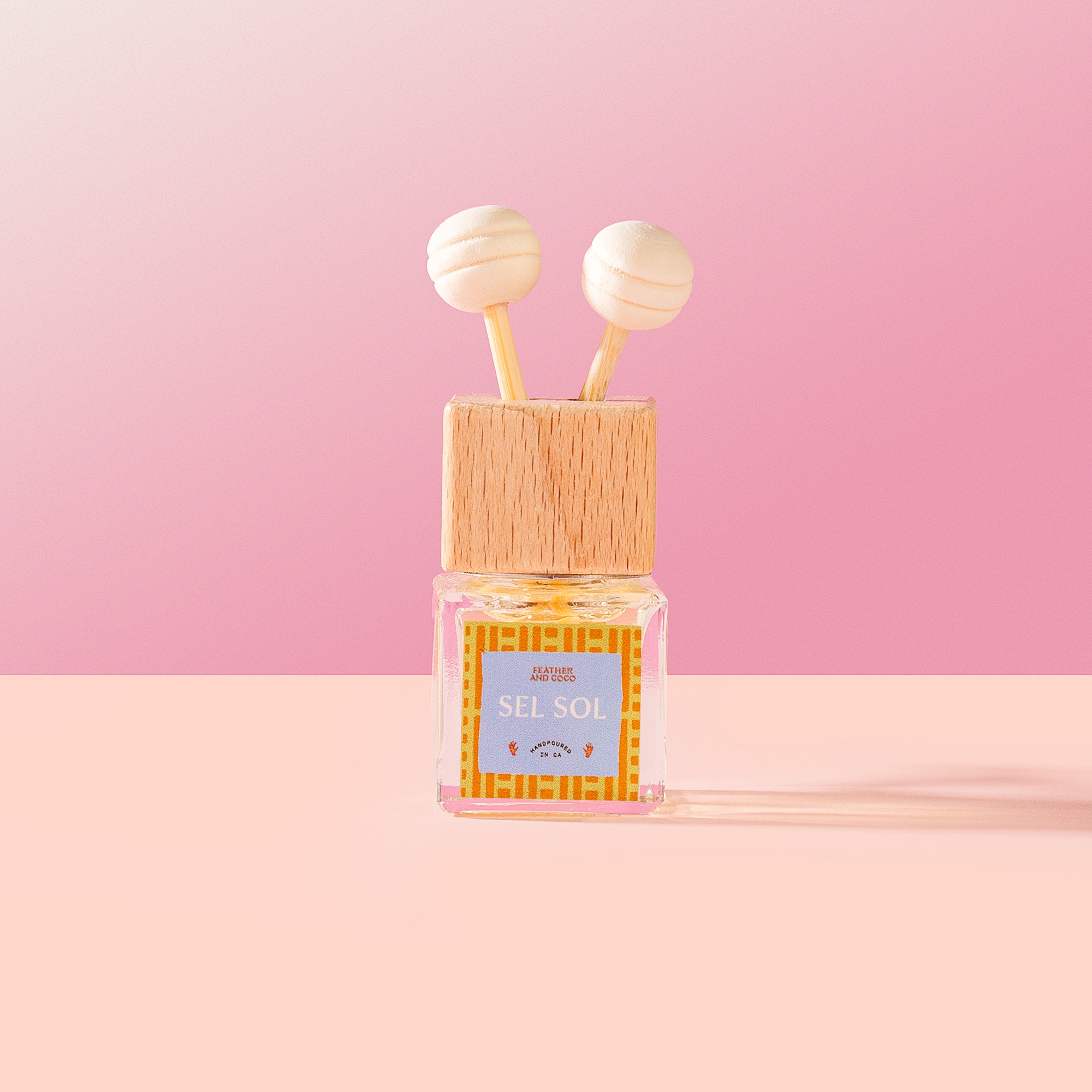 Sel Sol Car Diffuser on a pink background.